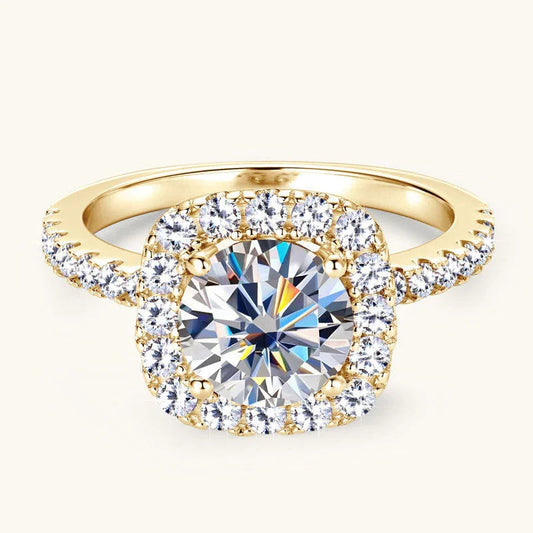 Gold engagement ring with a large round-cut center diamond and pavé diamond halo setting