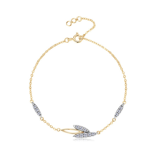 Gold chain bracelet with leaf-shaped crystal accents on white background