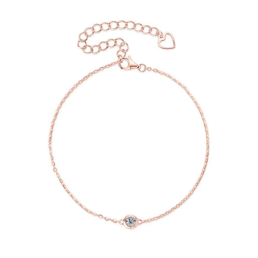 Rose gold delicate chain bracelet with single round blue gemstone and heart charm