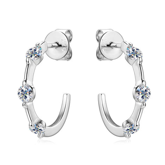 Sterling silver half hoop earrings with round clear cubic zirconia stones