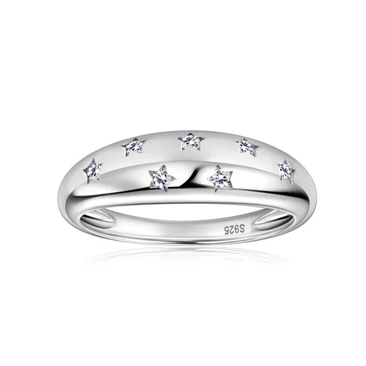 Sterling silver ring with star-shaped cubic zirconia accents on white background