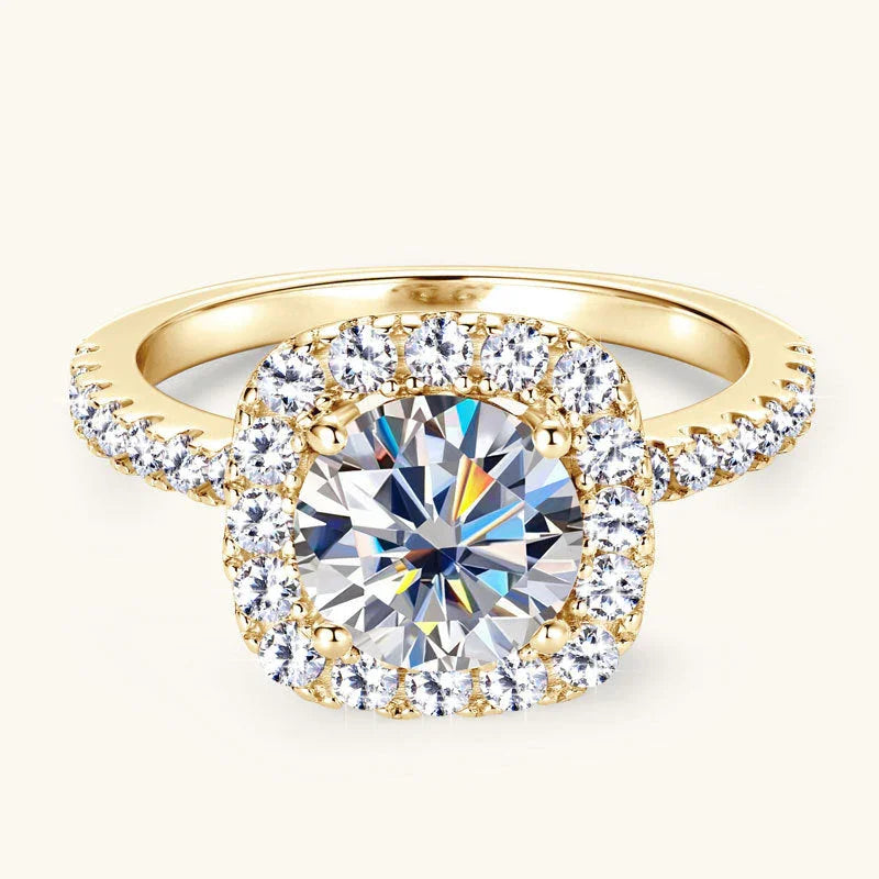 Gold engagement ring with a large round-cut center diamond and pavé diamond halo setting